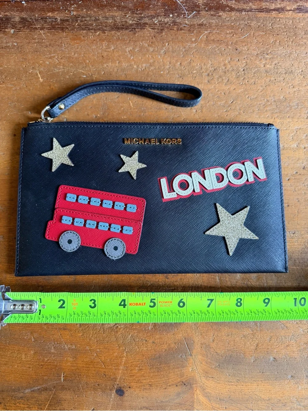 Michael Kors London Black Wristlet Clutch with Red Bus and Gold Stars
